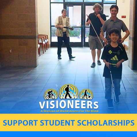 Visioneers. Support Student Scholarships. Image: Junior Visioneer Nathan leads Visioneers Daniel Kish and Brian Bushway down a corridor in a community recreation center by using FlashSonar by way of a hand clicker and his perception cane.