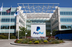 Image: Photograph of the exterior of PayPal's Headquarters showing two building wings joined at a central atrium.