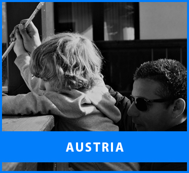 Austria. Image: Black and white photo of Senior Multicultural Visioneer Juan Ruiz working with a young blind student in Tyrol, Austria.