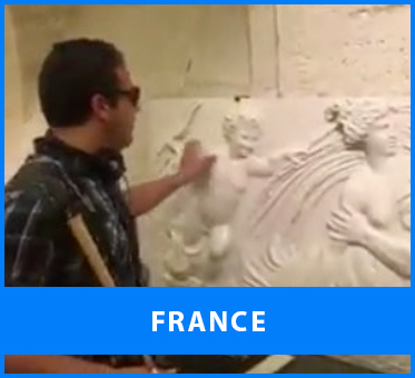 France. Image: Senior Multicultural Visioneer Juan Ruiz scouts sculpted entablature for tactile interest at the Louvre in Paris, ahead of a training session.