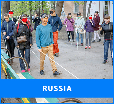 Russia. Image: Workshop Visioneer Thomas Tajo leads blind and sighted participants in the outdoor portion of two workshops at the soundartist.ru Sound festival in Moscow.