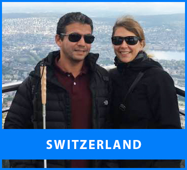 Switzerland. Image: Senior Multicultural Visioneer Juan Ruiz and his wife Nina pause for a scenic photo at an outlook in Zurich on the way to a training session.