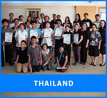 Thailand. Image: A group photo at the Foundation for the Blind in Thailand asVisioneers Daniel Kish, Brian Bushway and Thomas Tajo stand with staff members and blind trainee Visioneers coaches after they've received their Instructor Certificates of various ranks.