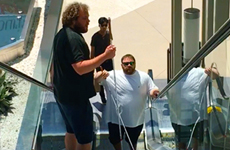 Kevin Rising. Image: Senior Visioneer Brian Bushway and student Visioneer Kevin, rise up an escalator at an L.A. mall.