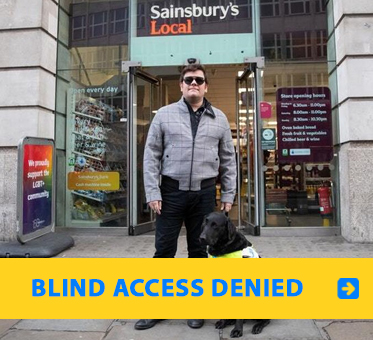Blind Access Denied. Photo shows blind UK Paralympic skiing champion John Dickinson-Lilley standing with his guide dog outside a Sainsbury's Local market in London where he was denied access.